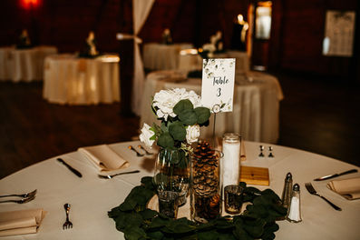 Winter wedding table centerpiece with pinecones
