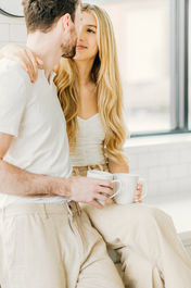 fun couple poses for engagement photo shoot