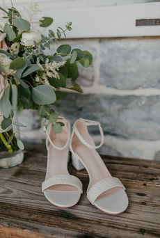 bridal shoes with bouquet