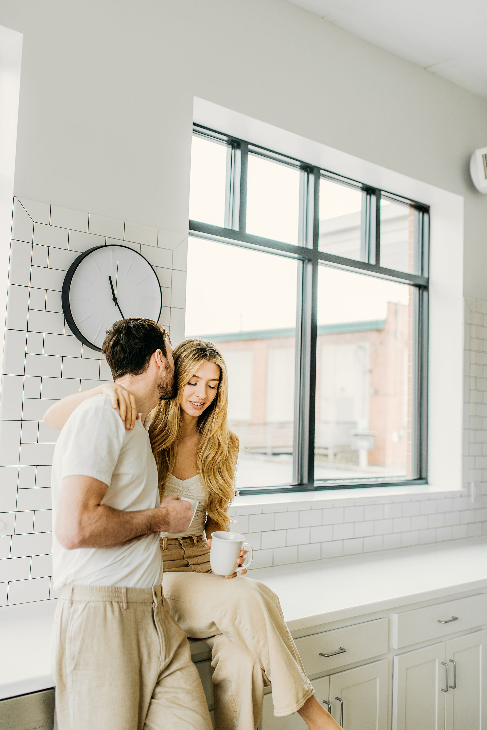 fun couple poses for engagement photo shoot