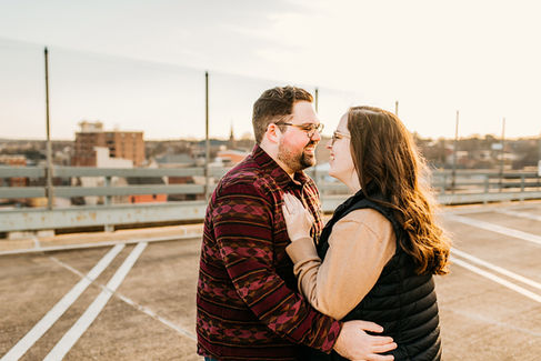 couple laughing on city rooftop