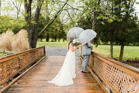 A rainy wedding day first look