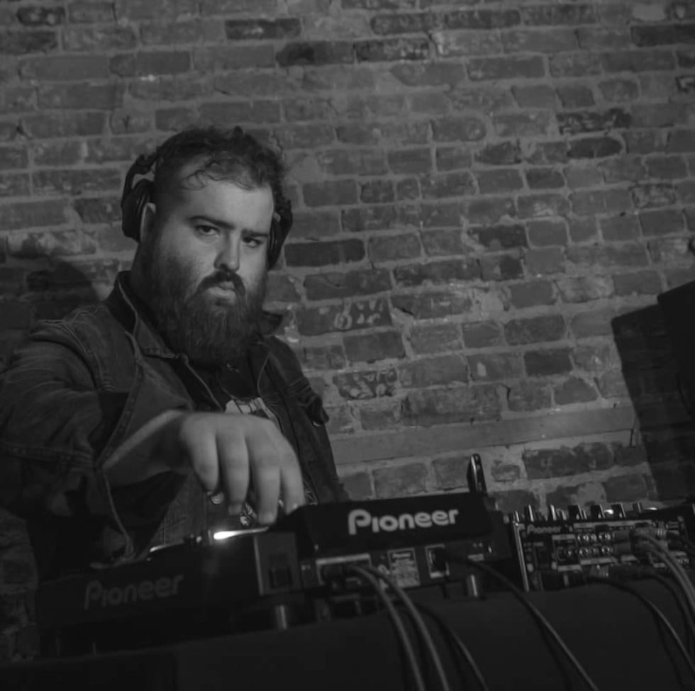 Canadian DJ De Frenza performing on Pioneer DJ Equipment at an event in Montreal