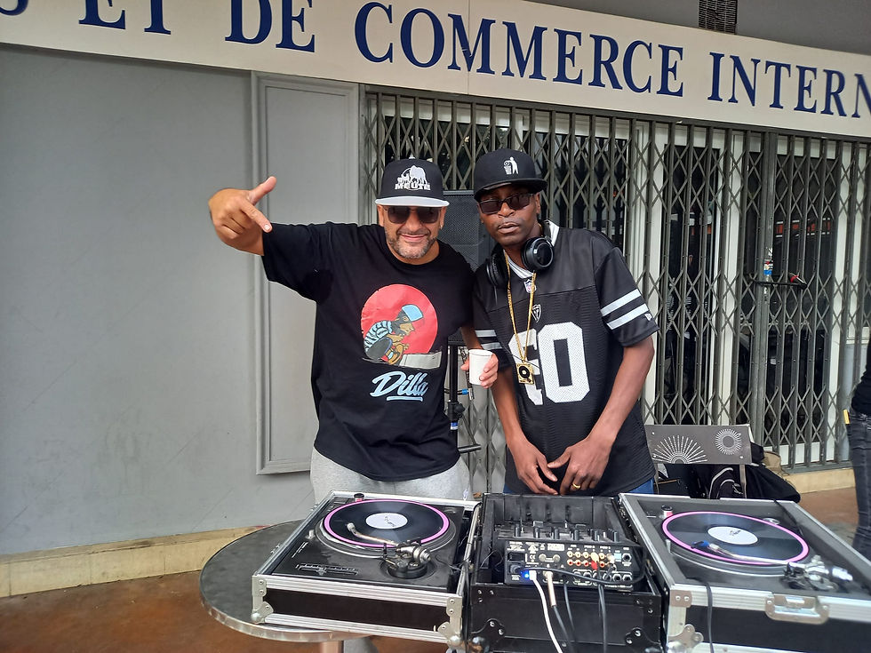 French DJs and producers DJ Ronsha and G-Zon performing at a street party in Paris, colour image.