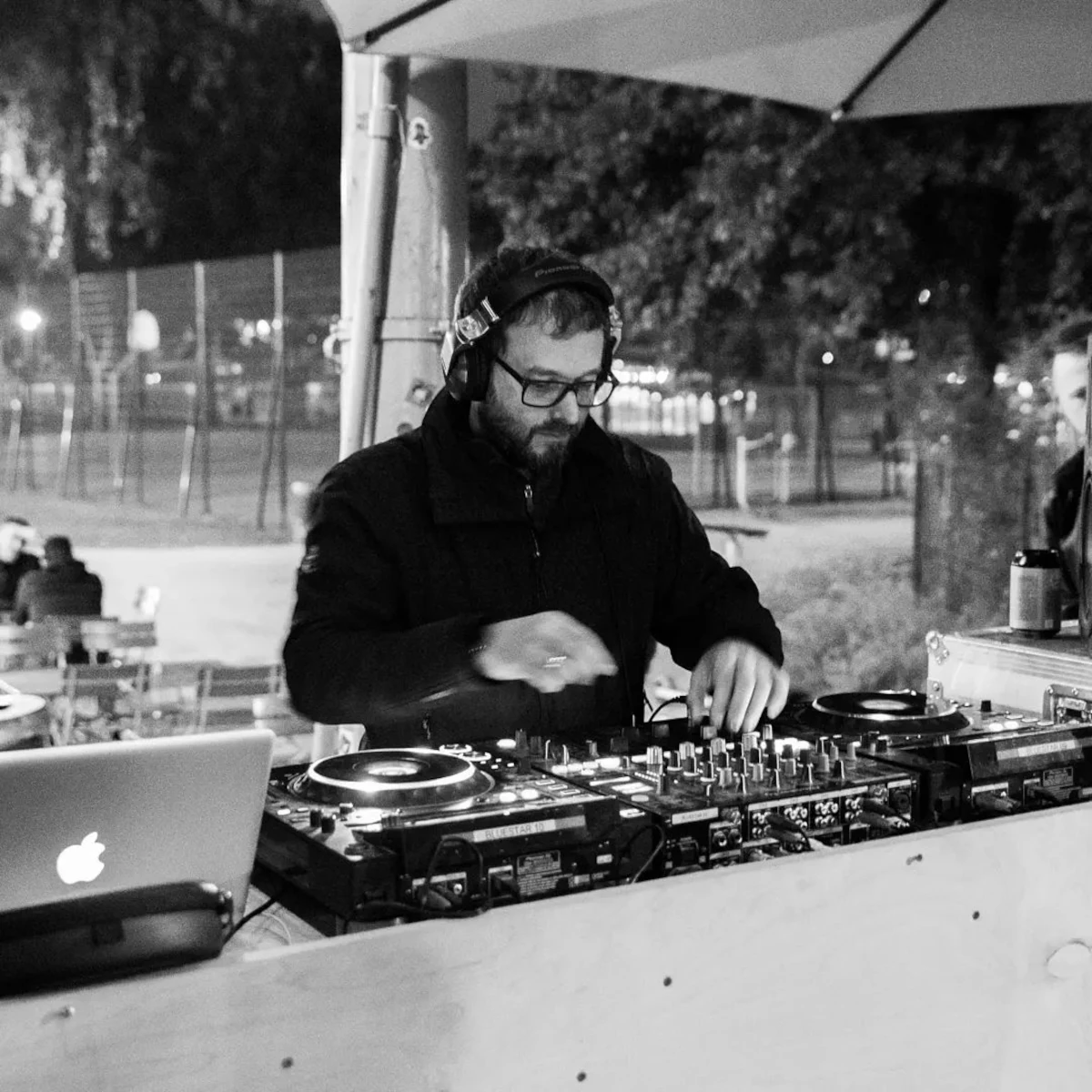 Hungarian DJ and producer Drekaan performing at an event, black and white image.