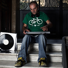 Marco Mei Sitting with his Laptop on a doorstep