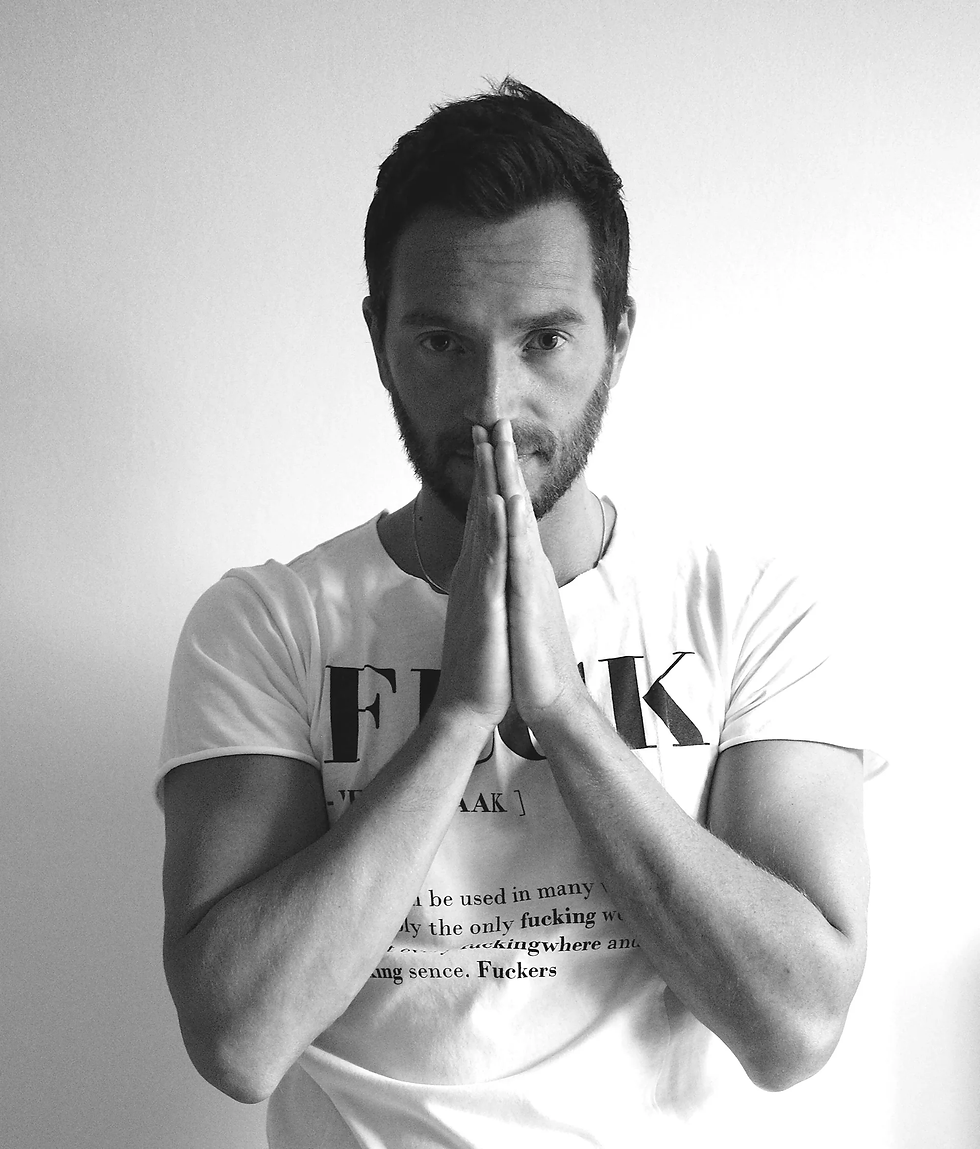 Italian DJ and producer INVE praying in upper body black and white image.
