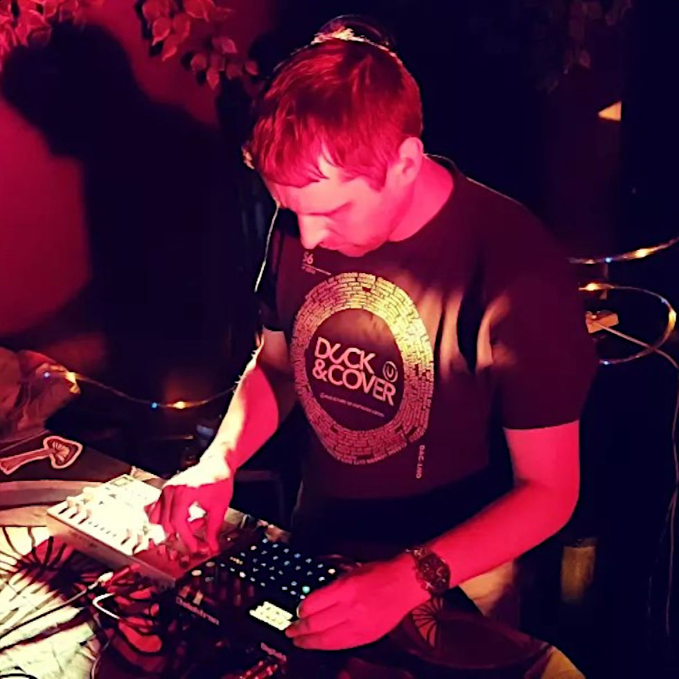 British DJ and producer Kev Willis performing at Electric Tentacle, Stoke-on-Trent, England, colour image.