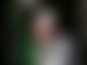 British DJ and Producer Blaze UK performing at an event wearing a baseball cap, colour image.