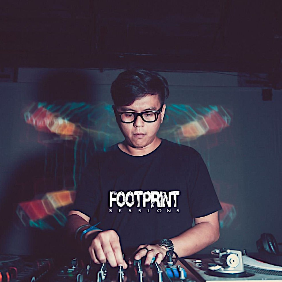 Malaysian DJ and producer Terence C performing at an event, colour image.