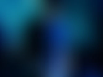 DJ Lastveek performing a live set in a club setting with visual projections and blue lighting.