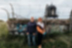 Portrait of Killian Walsh and Elise SW standing together outdoors beside a graffiti-covered wall ahead of the release of their collaborative album Ise.