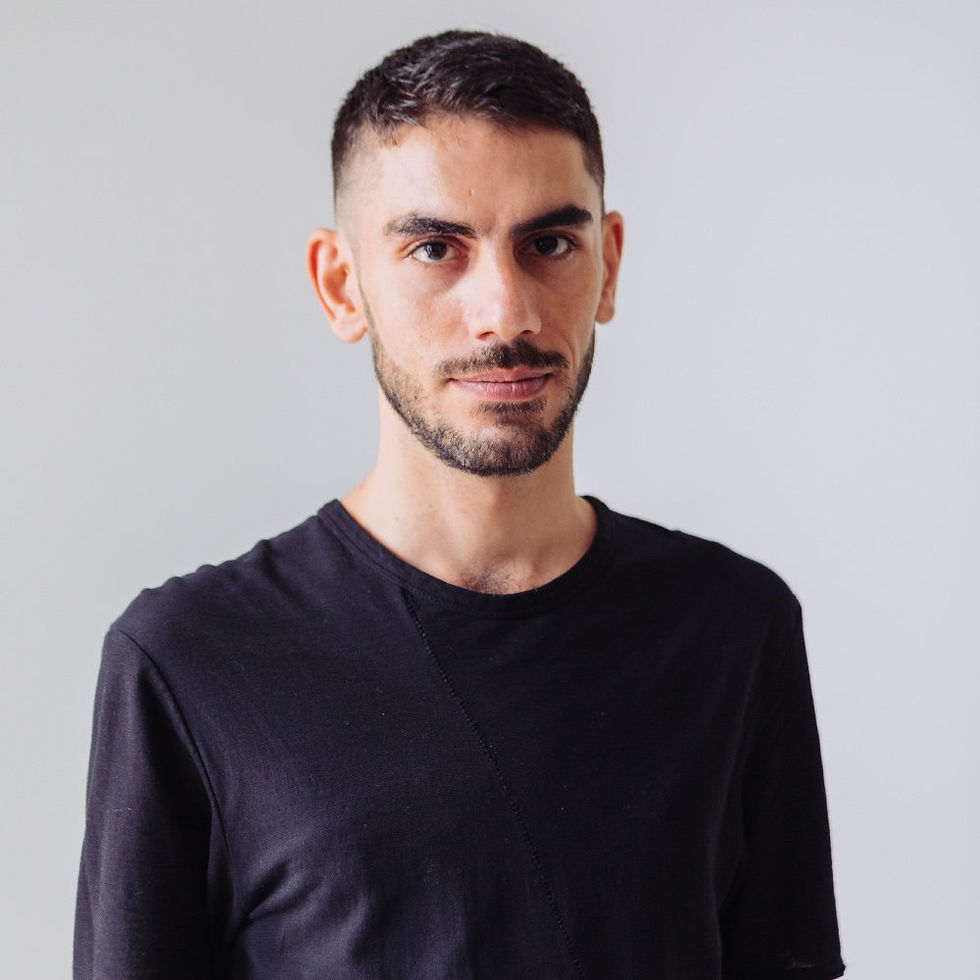 Malaysia based Iranian DJ and producer Otherkind standing in front of camera, colour image.