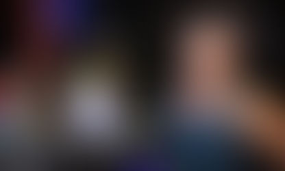 British DJ and producer Graham Gold performing at Nest Cafe looking to his left at the camera, colour image.