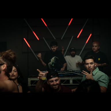 American DJ Andre performing at an event in Los Angeles, California, U.S.A, with the picture taken from the crowd in a colour image.