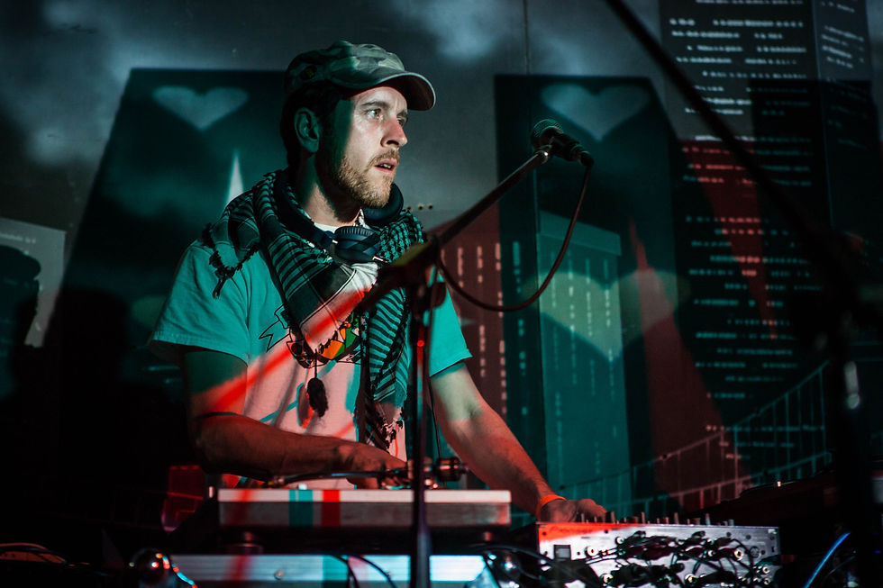 J Star performing as a Deejay at an Event, colour image.
