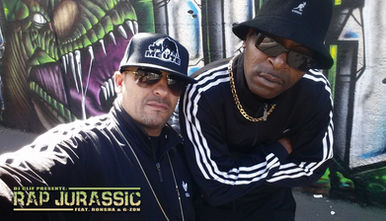 French DJs and producers DJ Ronsha and G-Zon at the photo shoot for Rap Jurassic in front of a graffiti wall in Paris, colour image
