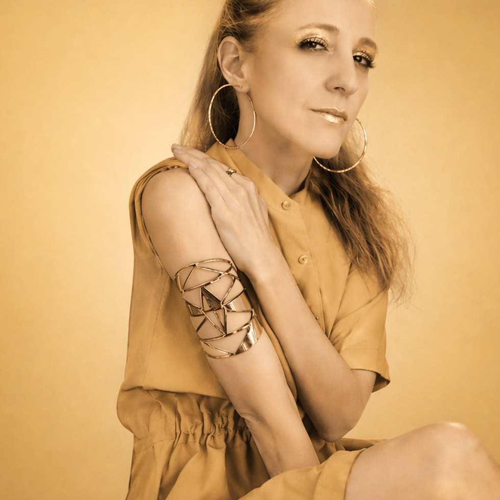 Portrait of singer-songwriter Georgia Cee against a warm gold background, representing her Afro House, soulful songwriting and underground club influences.