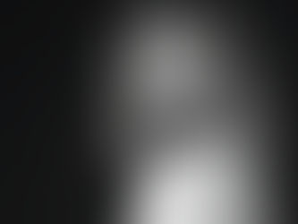 Progressive House DJ and producer Tabrissel in a black-and-white studio portrait, looking over her shoulder against a dark background.