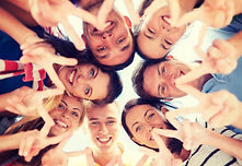 summer, holidays, vacation, happy people concept - group of teenagers looking down and sho