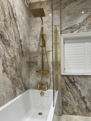 modern bathroom. natural brass and stone effect shower panels