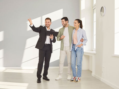 Estate agent viewing a property with clients