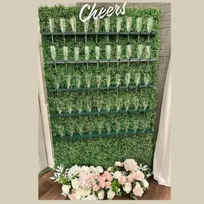Elegant champagne wall rental with filled glasses, perfect for weddings and upscale events in Toronto and Edmonton.