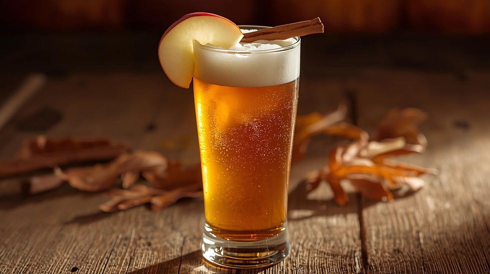 A tall glass filled with golden cider and beer, topped with a frothy head. Garnished with a fresh apple slice and a cinnamon stick, it sits on a rustic wood table surrounded by warm autumn tones of leaves and soft lighting, creating a cozy fall atmosphere.