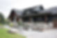 Dark grey steel siding on beautiful home.