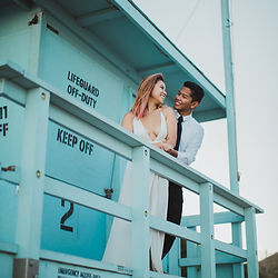 Engagement photo on beach lifeguard station