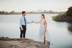 Couple hold hands to dance at Malibu lagoon