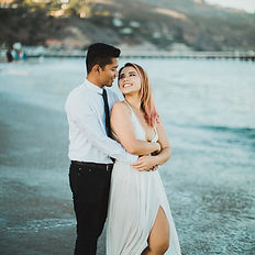 Engagement photo happy couple Malibu beach