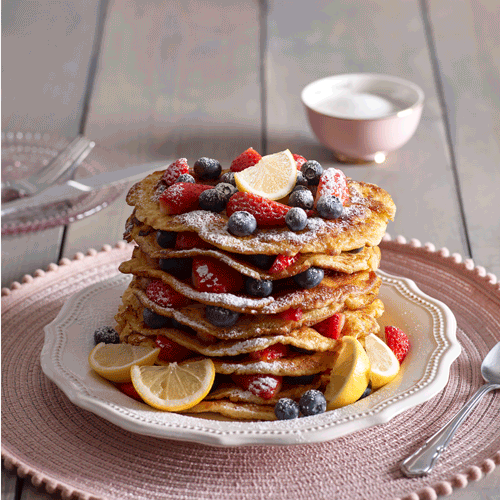 Stcak of pancakes being cut into