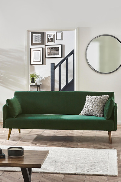 Green sofa in a living room