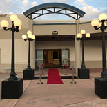 Lamp posts and carpet set up for a grand entrance to a prom