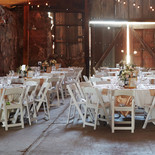 Wedding chairs in a barn wedding reception