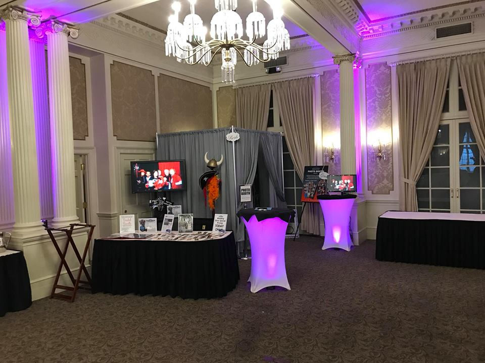 Thumbnail: Curtained booth with lighting accents to decorate the photo booth