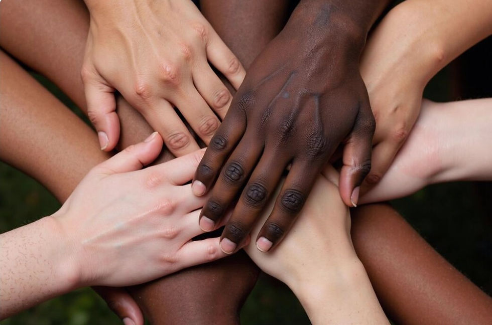 Close-up of diverse hands stacked together symbolizing unity