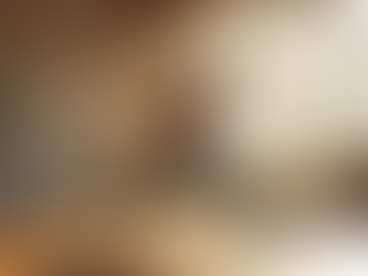 Practicing Warrior I yoga pose in a bright studio