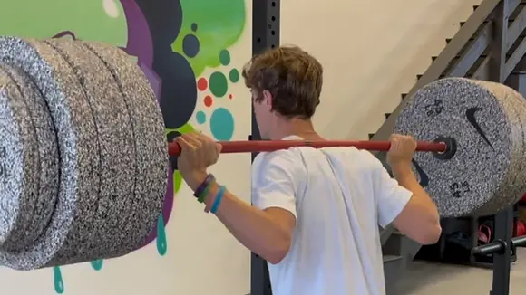 Teen squat bar boy.webp