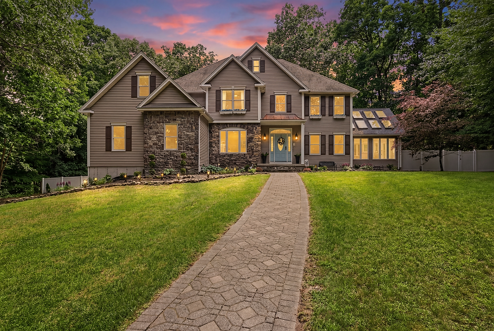 Twilight real estate photography of a luxury home in Wilbraham, Massachusetts by Seven Roads Media.