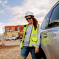 construction personnel, woman wearing vest and hard hat