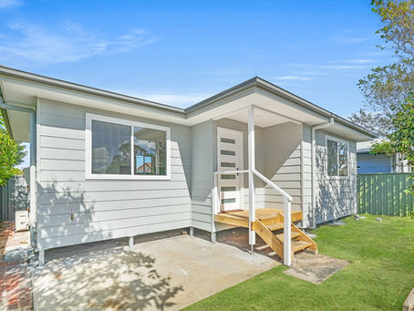 Exterior view of newly built Woy Woy granny flat with modern cladding and covered entry deck