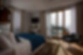 Spacious guest room at Villa T Dubrovnik with modern decor and balcony