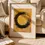 Miniaturbild: Poster mit schwarzem Enso-Kreis auf goldenem Hintergrund, das Balance und Harmonie ausstrahlt.
