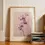 Miniaturbild: Orchideen-Poster: Zartrosa Orchideenblüten an einem Stiel
