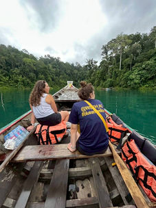 Scenic boat cruise across the emerald waters before departure