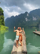 Couple exploring limestone landscapes on Cheow Lan Lake