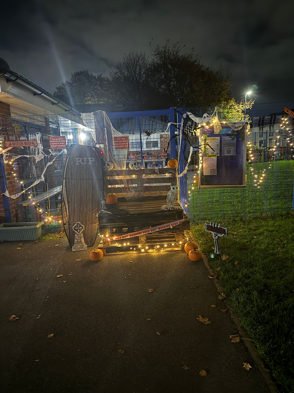 Eye-level view of a decorated school hallway filled with Halloween decorations