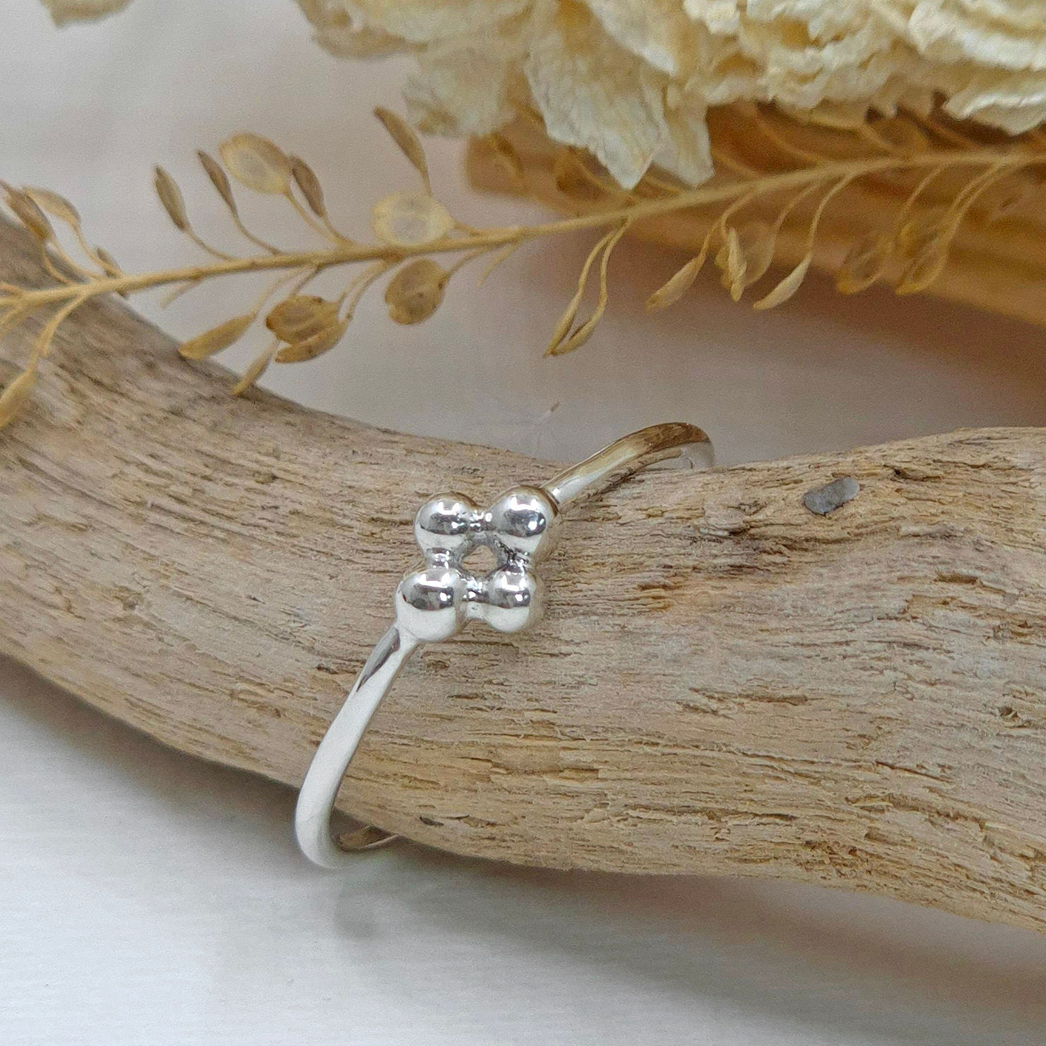 Handmade Argentium silver Bud stacking ring with four polished silver granulations.